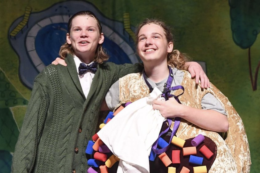 Junior Elijah Lemon (left) and senior Ben Evans (right) pose in a scene celebrating their strong friendship during "Arnie and the Doughnut." Lemon plays Mr. Bing and Evans plays Arnie.